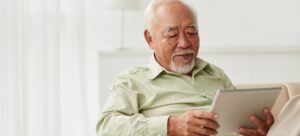 Older man reading the news