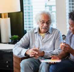 elderly man and caretaker discussing medications 1397411369 1200 776