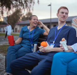 medical staff talking smiling on outdoor bench 1446502648 1200 776