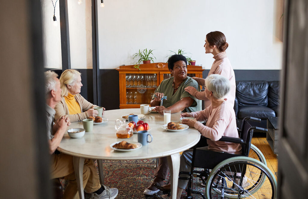 nursing home worker serving residents 1200 776