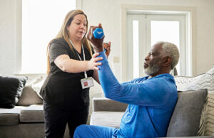 senior man exercising with caretaker 1407245261 1200 776