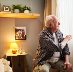 senior man sitting in bedroom 1200 776