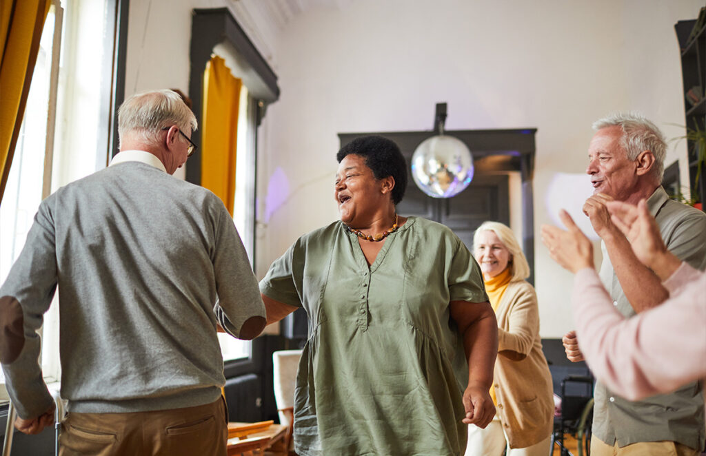 senior nursing home residents dancing together 1200 776