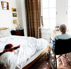 senior woman on wheelchair in bedroom 1200 776