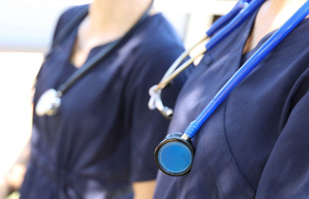 two medical professionals with stethoscopes 1356654993 1200 776