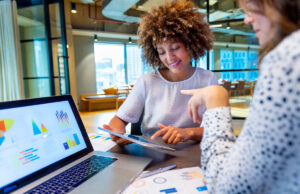 two women meeting with computers in office 1412762526 1200 776