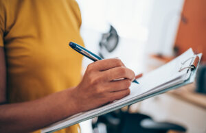 woman taking notes on clipboard 1434437996 1200 776