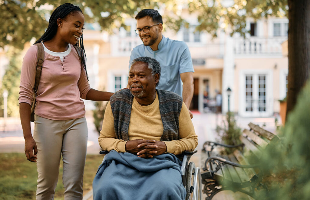 young woman visiting senior relative at nursing home 1200 776
