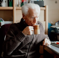 senior man drinking coffee at home 1200 776