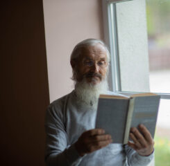 senior man reading book 1200 776