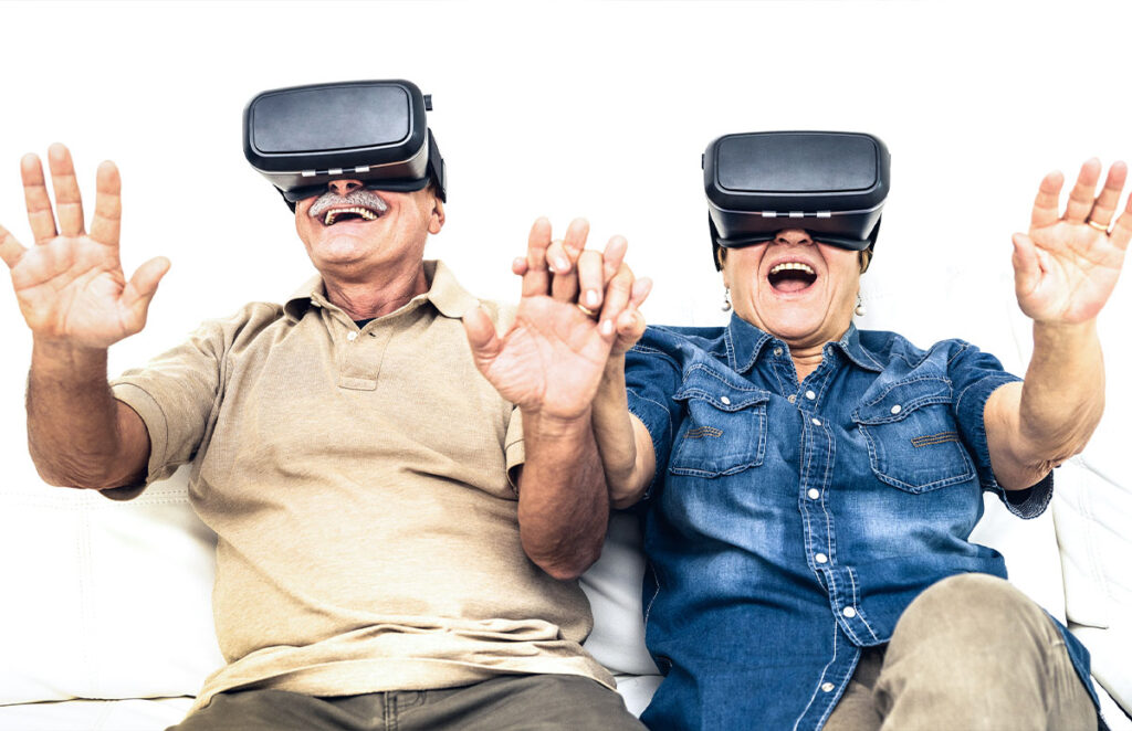 senior mature couple having fun together with virtual reality headseats 1200 776