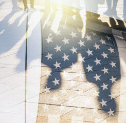 Shadows of People in a street and Flag of The USA as Background concept toned Picture