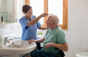 Caregiver giving resident haircut 693238050 1200 776