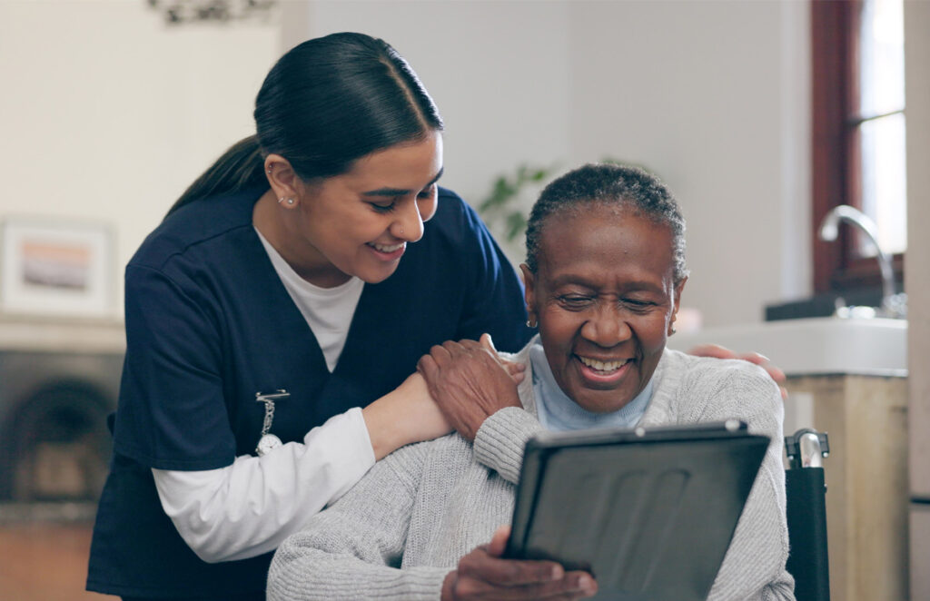 Caregiver leaning behind resident 1975794314 1200 776
