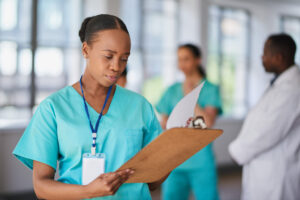 Focused Nurse Reviewing Patient